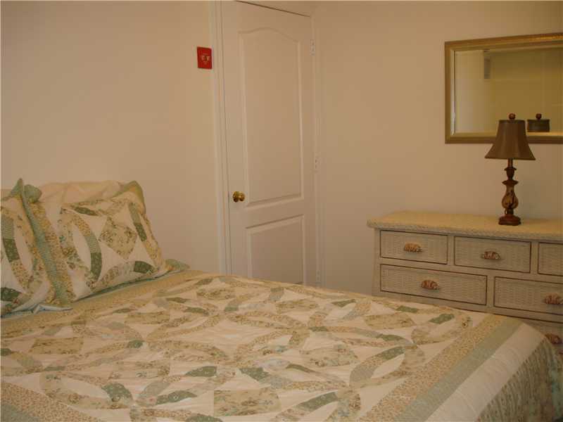 102 Long Close Road Stamford, CT 06902 - Photo 17 of 25 a bedroom with a bed and a mirror