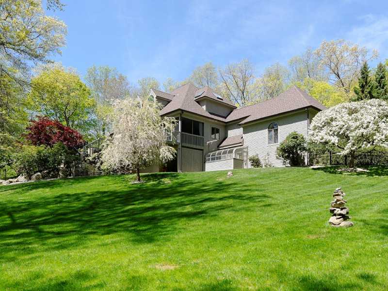 102 Long Close Road Stamford, CT 06902 - Photo 25 of 25 a front view of a house with a garden