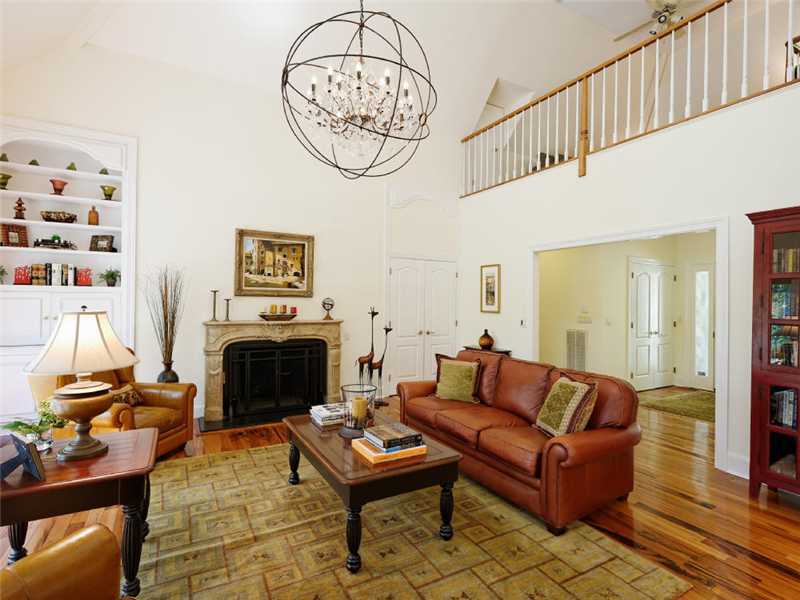 102 Long Close Road Stamford, CT 06902 - Photo 3 of 25 a living room with furniture a flat screen tv and a fireplace