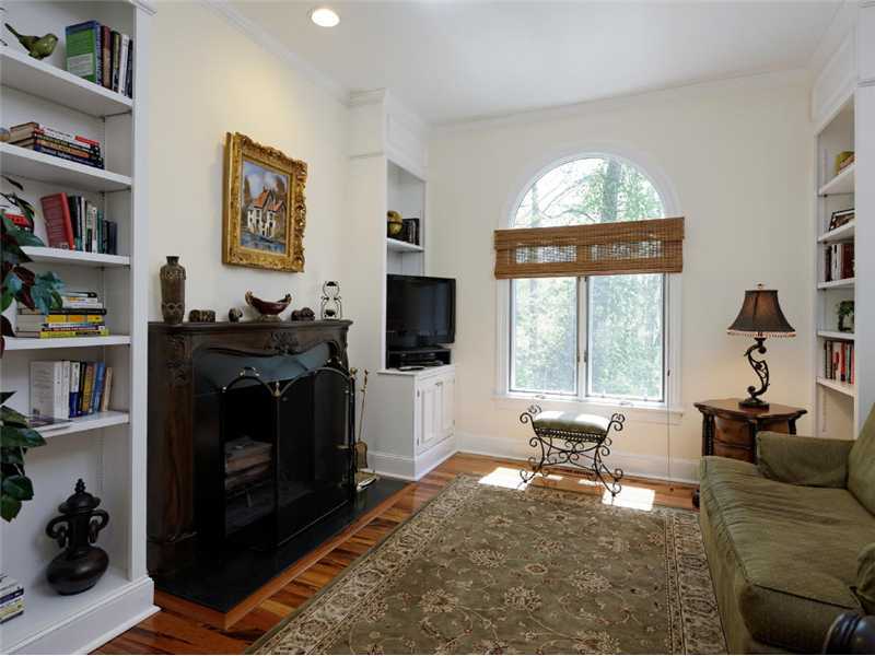 102 Long Close Road Stamford, CT 06902 - Photo 5 of 25 a living room with furniture a flat screen tv and a fireplace