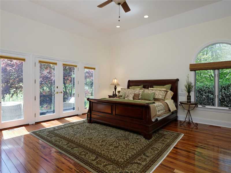 102 Long Close Road Stamford, CT 06902 - Photo 6 of 25 a bed sitting in a bedroom next to a window