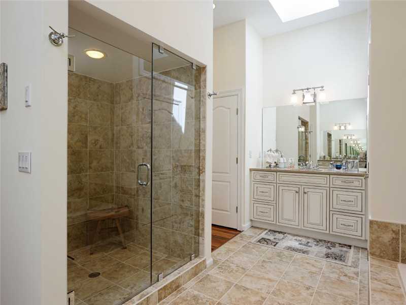 102 Long Close Road Stamford, CT 06902 - Photo 8 of 25 a bathroom with a shower sink and mirror