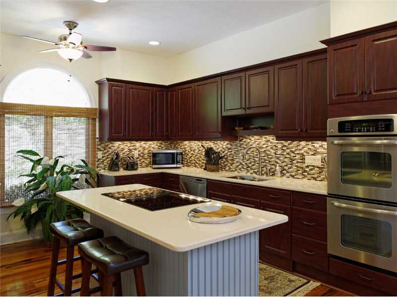 102 Long Close Road Stamford, CT 06902 - Photo 9 of 25 a kitchen with a table a sink and cabinets