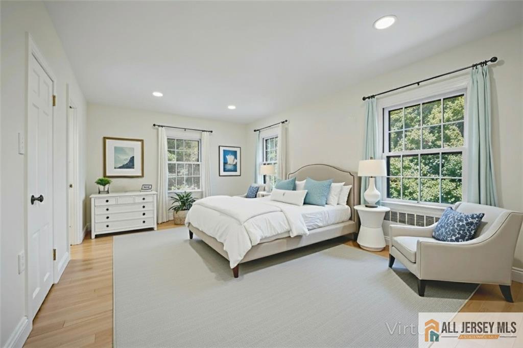 205 Ashland Road Middlesex, NJ 08846 - Photo 15 of 50 a spacious bedroom with a bed a couch and a window