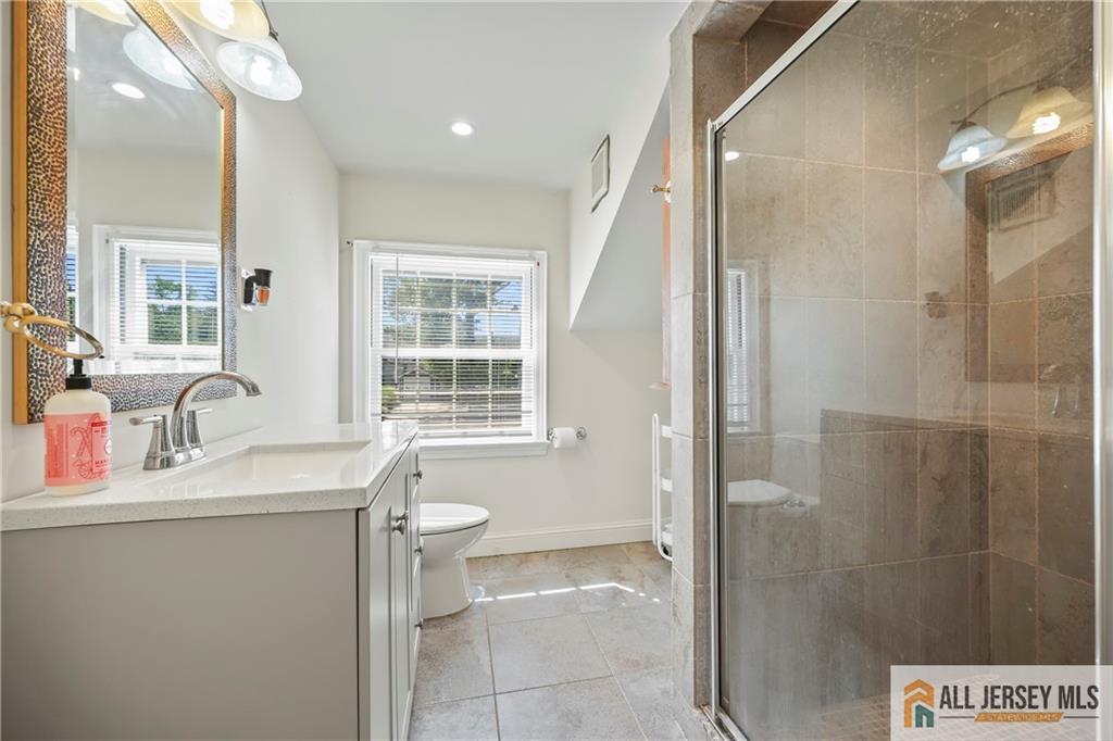 205 Ashland Road Middlesex, NJ 08846 - Photo 16 of 50 a bathroom with a sink and a mirror