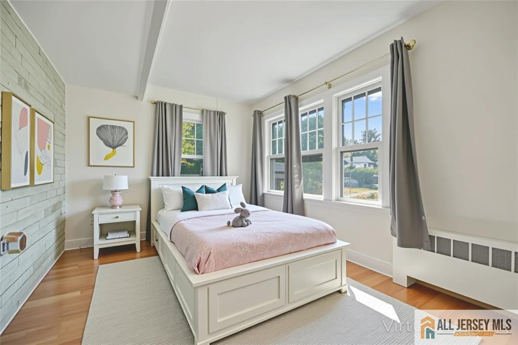205 Ashland Road Middlesex, NJ 08846 - Photo 18 of 50 a spacious bedroom with a bed and a large window