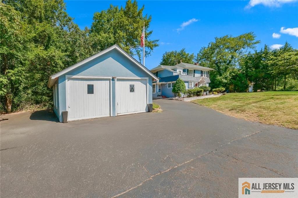205 Ashland Road Middlesex, NJ 08846 - Photo 2 of 50 a view of a house with a yard and large trees