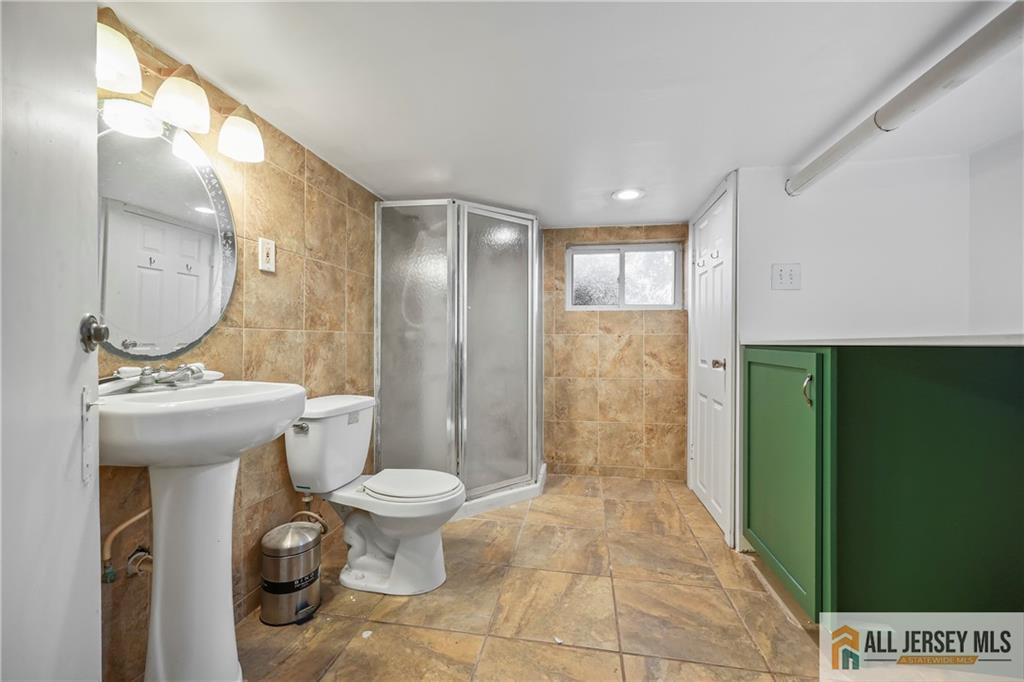 205 Ashland Road Middlesex, NJ 08846 - Photo 24 of 50 a bathroom with a sink toilet and shower