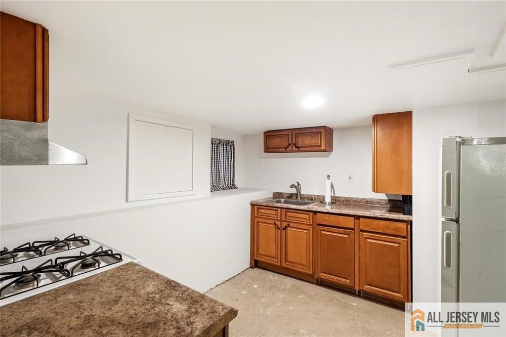 205 Ashland Road Middlesex, NJ 08846 - Photo 25 of 50 a kitchen with stainless steel appliances a sink and a refrigerator