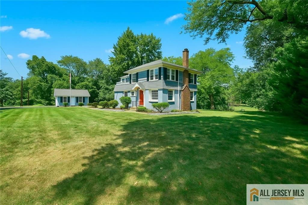 205 Ashland Road Middlesex, NJ 08846 - Photo 26 of 50 a front view of a house with garden