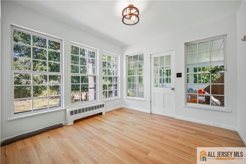 205 Ashland Road Middlesex, NJ 08846 - Photo 36 of 50 a view of an empty room with a window and wooden floor