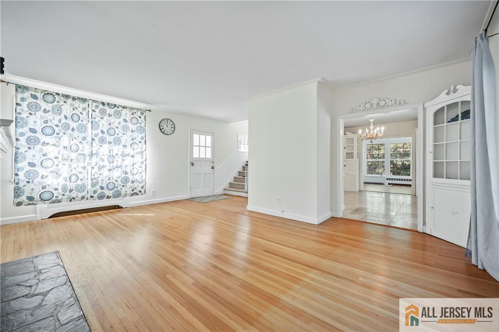 205 Ashland Road Middlesex, NJ 08846 - Photo 38 of 50 wooden floor in an empty room with a window