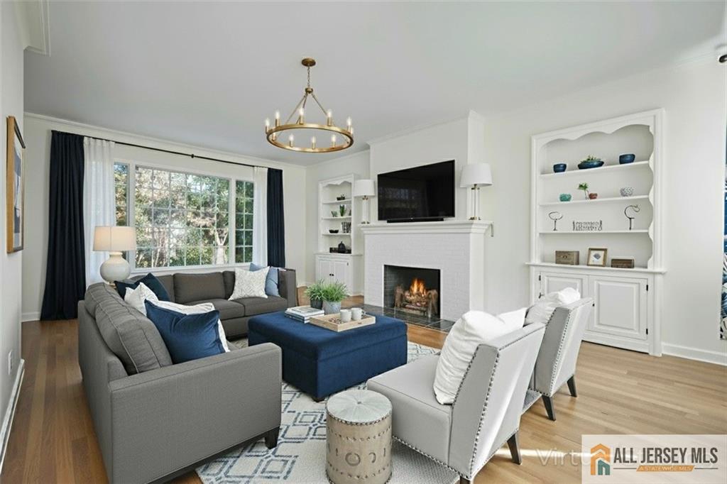 205 Ashland Road Middlesex, NJ 08846 - Photo 4 of 50 a living room with furniture a fireplace and a flat screen tv