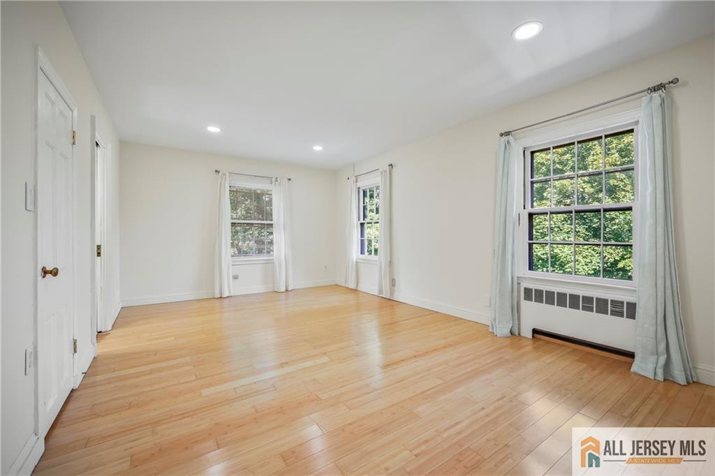 205 Ashland Road Middlesex, NJ 08846 - Photo 42 of 50 wooden floor in an empty room with a window