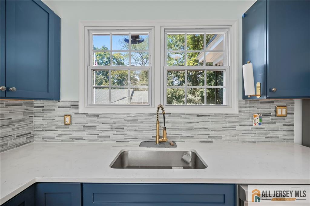 205 Ashland Road Middlesex, NJ 08846 - Photo 7 of 50 a kitchen with sink a window and cabinets