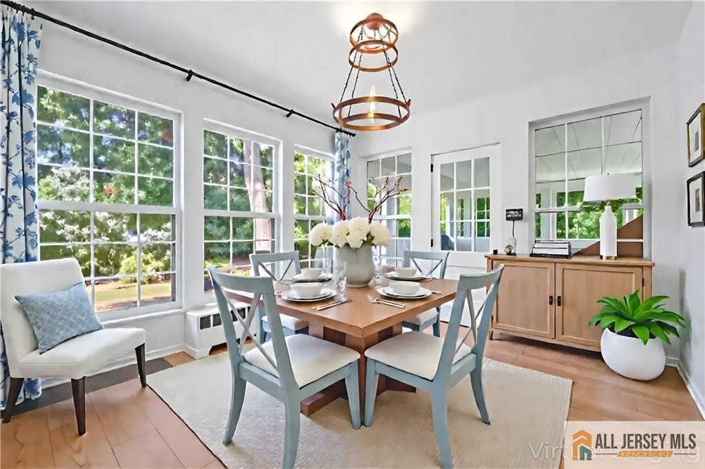 205 Ashland Road Middlesex, NJ 08846 - Photo 9 of 50 a dining room with furniture a livingroom and chandelier