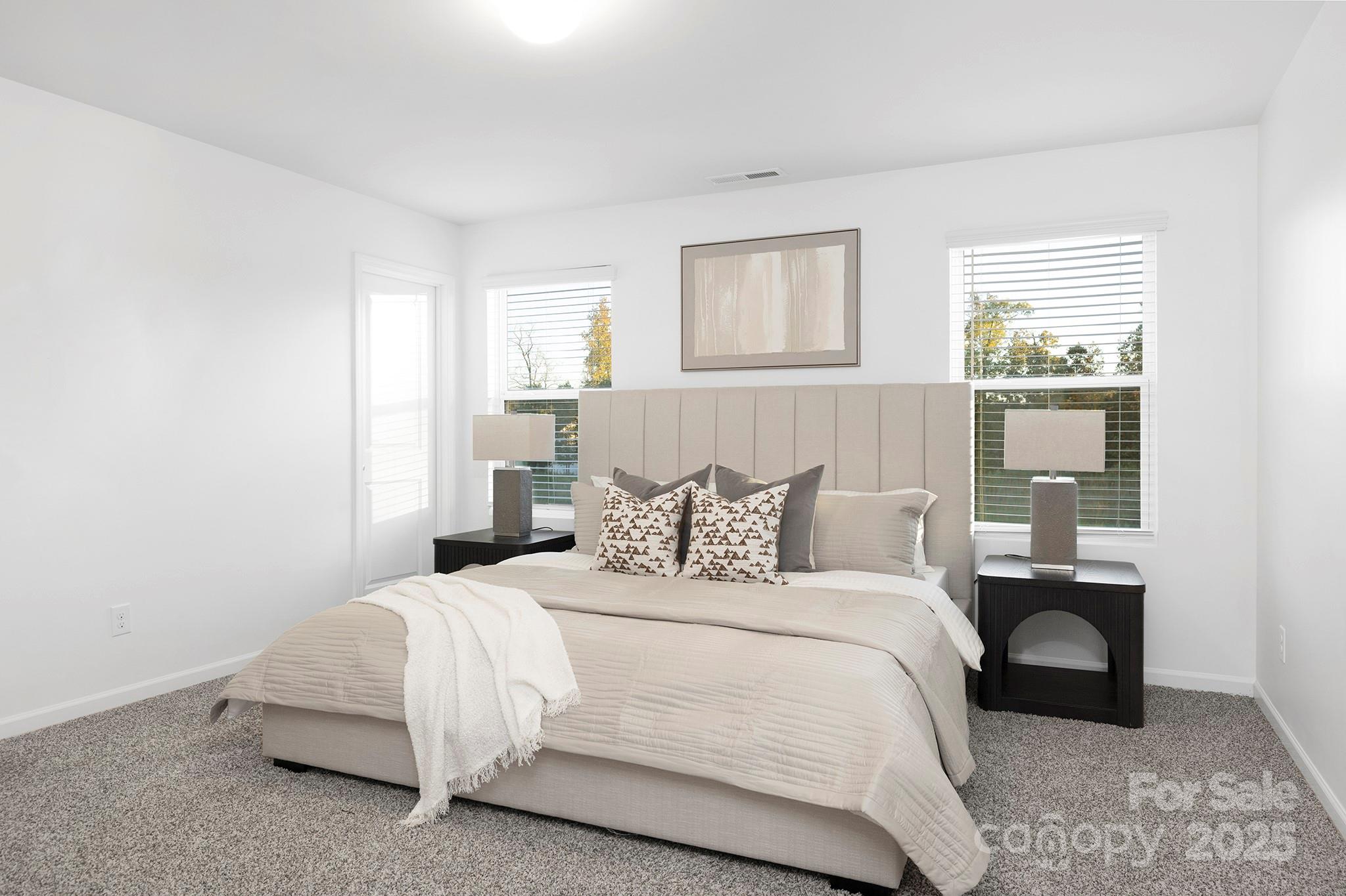 12970 Hill Pine Road, Unit 248 Midland, NC 28107 - Photo 14 of 30 a bedroom with a bed and a night stand