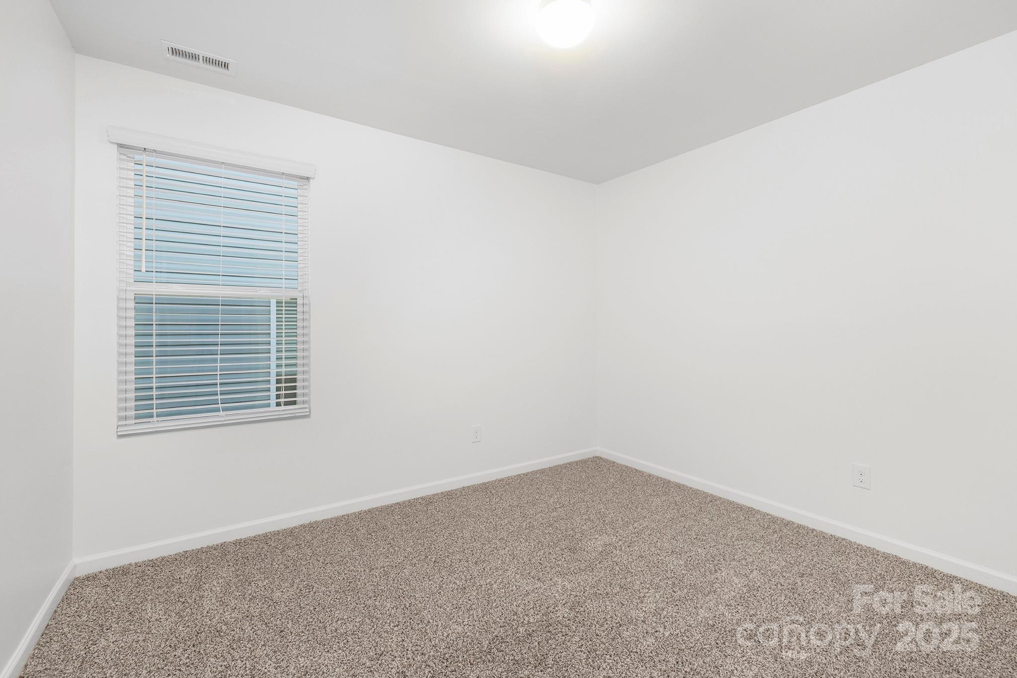 12970 Hill Pine Road, Unit 248 Midland, NC 28107 - Photo 18 of 30 an empty room with a window