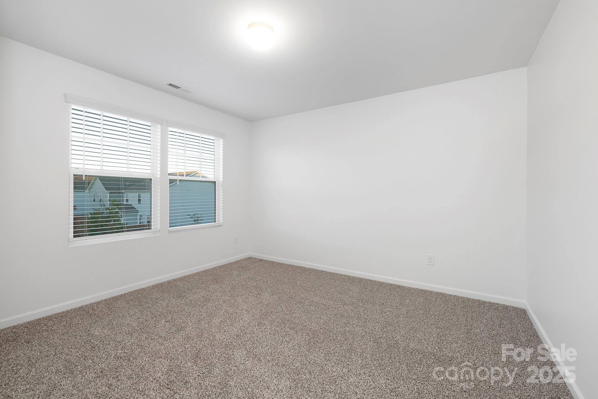12970 Hill Pine Road, Unit 248 Midland, NC 28107 - Photo 20 of 30 an empty room with windows
