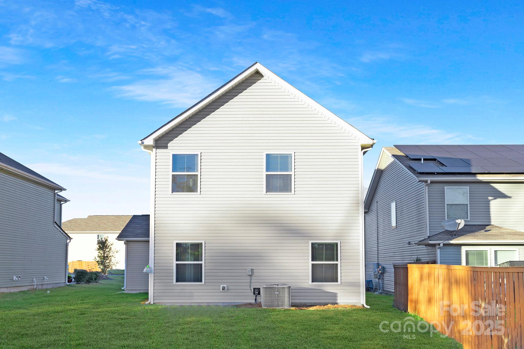 12970 Hill Pine Road, Unit 248 Midland, NC 28107 - Photo 28 of 30 a view of a house with a yard