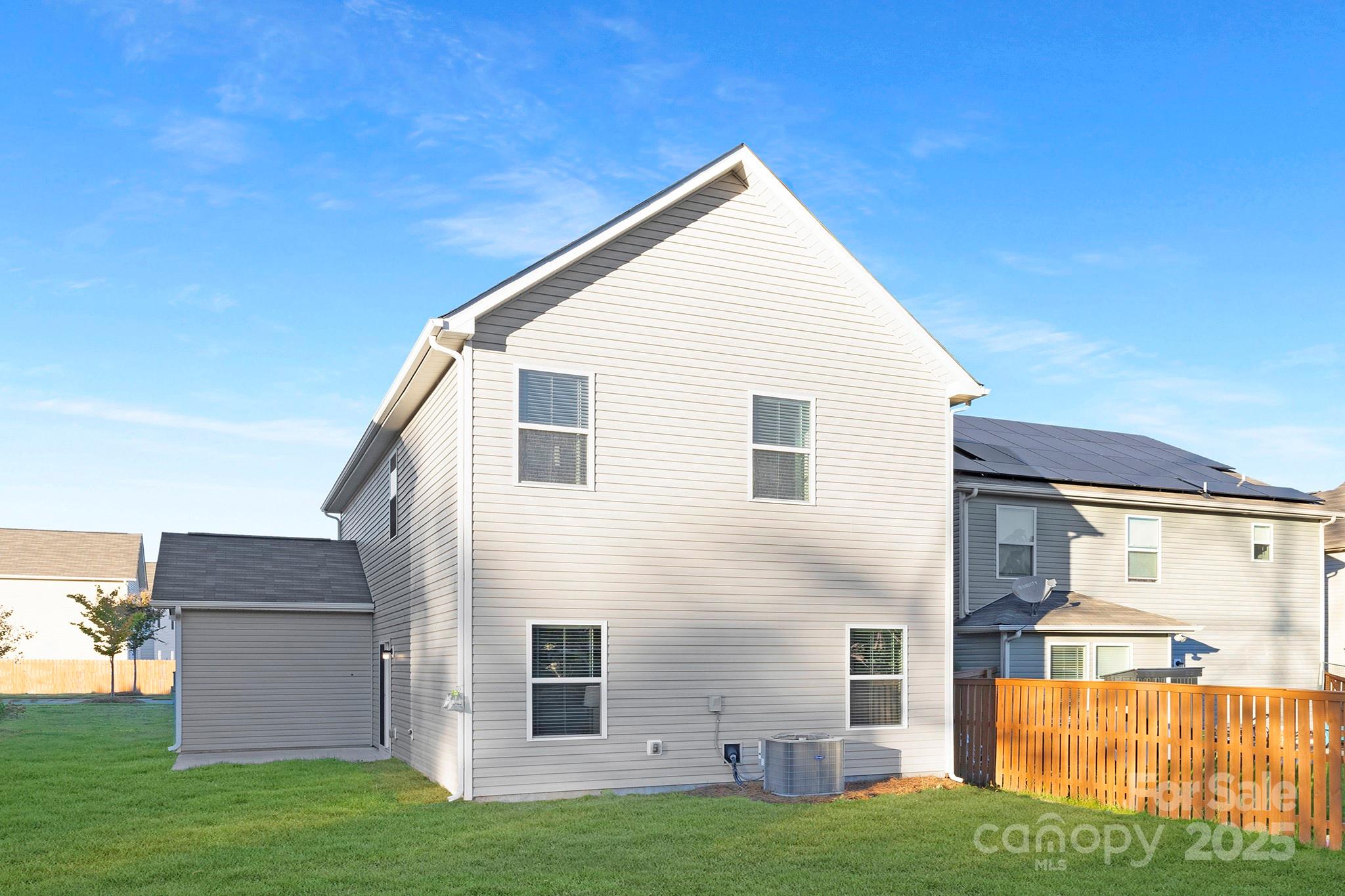 12970 Hill Pine Road, Unit 248 Midland, NC 28107 - Photo 29 of 30 a view of a house with a yard