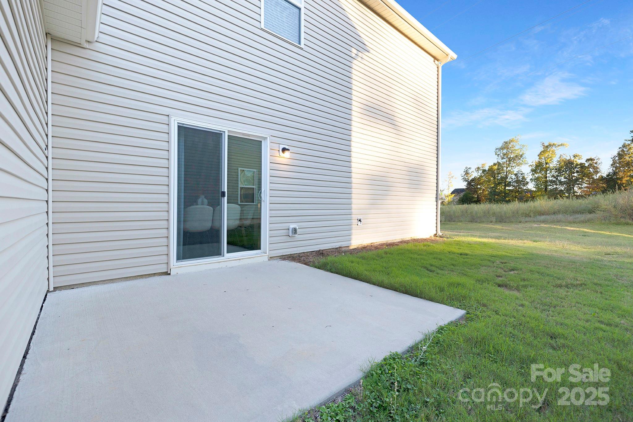 12970 Hill Pine Road, Unit 248 Midland, NC 28107 - Photo 30 of 30 a view of a backyard with plants and a garden