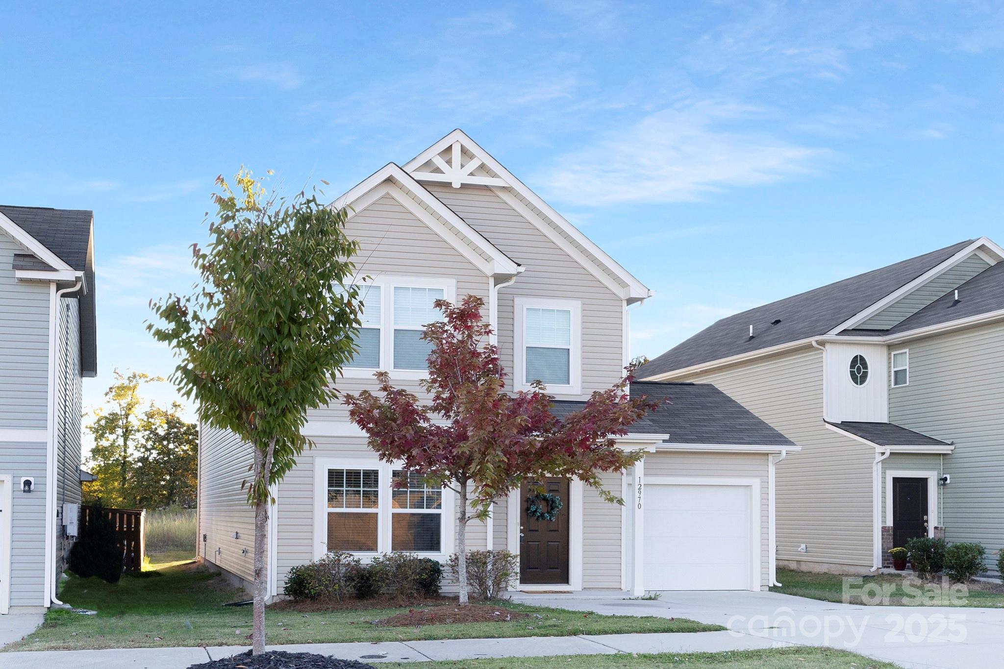 12970 Hill Pine Road, Unit 248 Midland, NC 28107 - Photo 3 of 30 a front view of a house with a garden