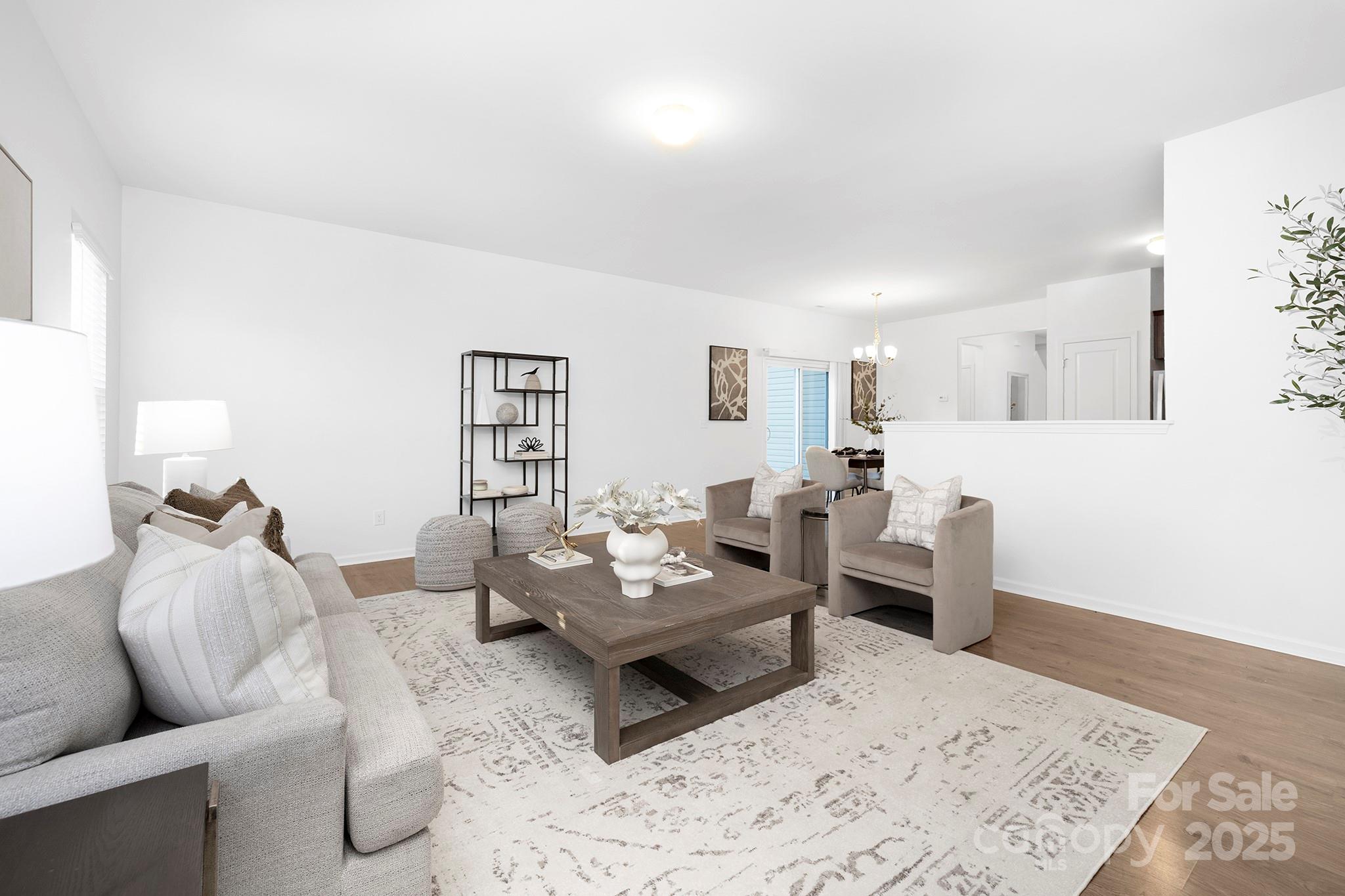 12970 Hill Pine Road, Unit 248 Midland, NC 28107 - Photo 9 of 30 a living room with furniture and wooden floor