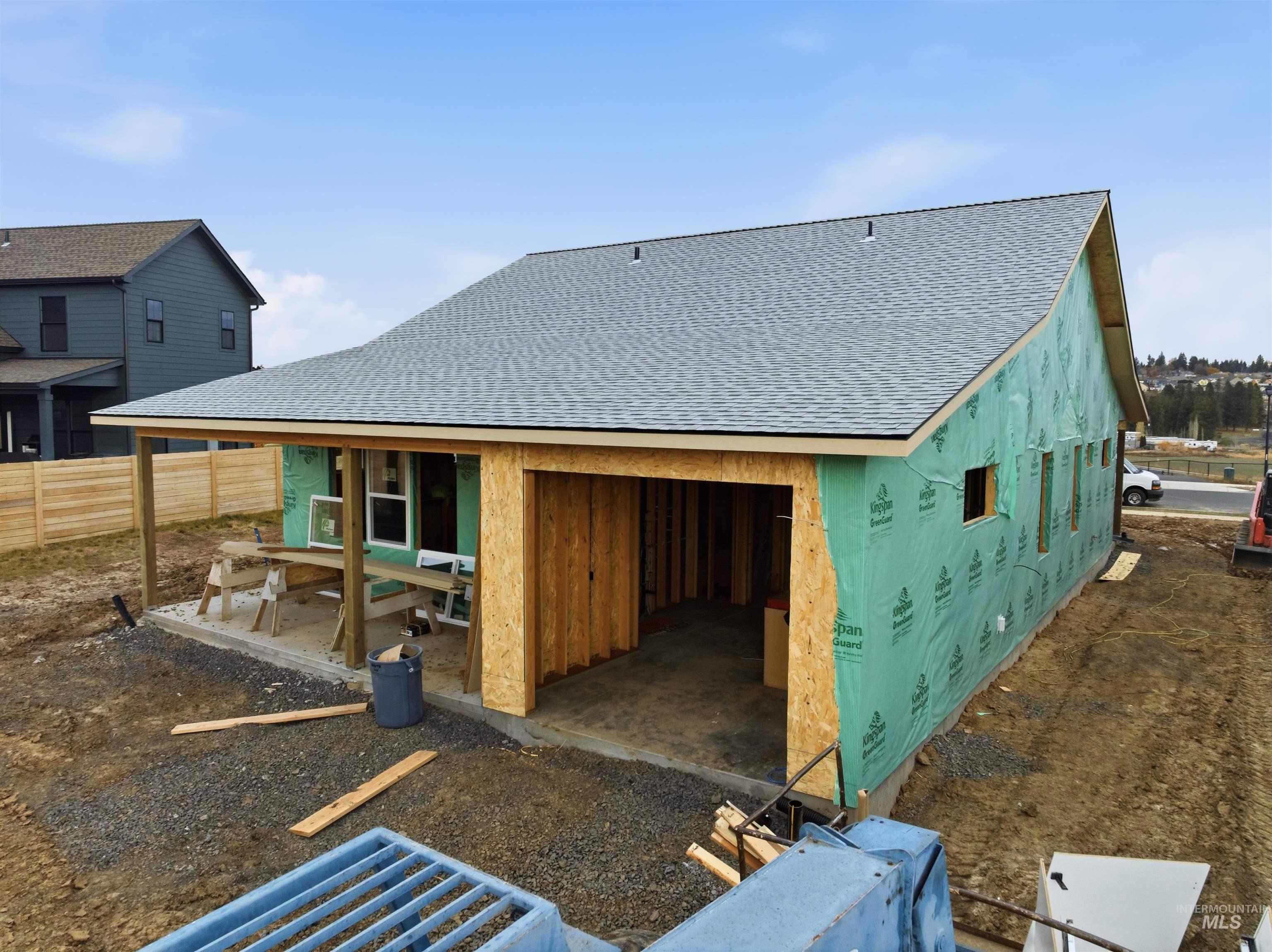 1007 Edington Avenue Moscow, ID 83843 - Photo 14 of 21 Rear view of house featuring roof with shingles and a patio