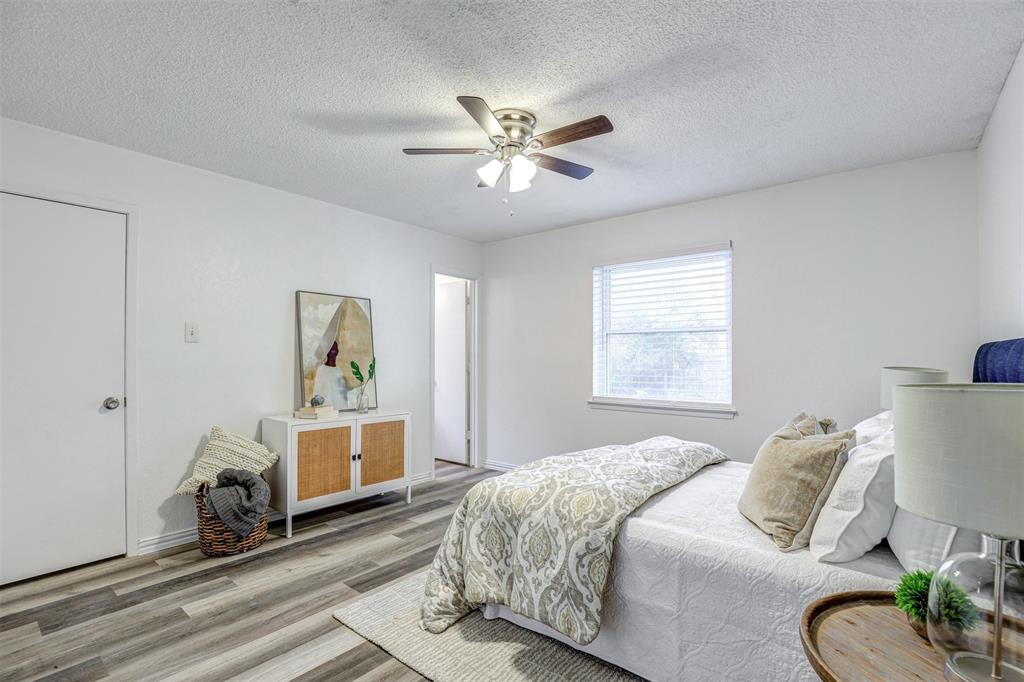 6005 Oak Hill Road Watauga, TX 76148 - Photo 12 of 22 a bedroom with a bed furniture and a window