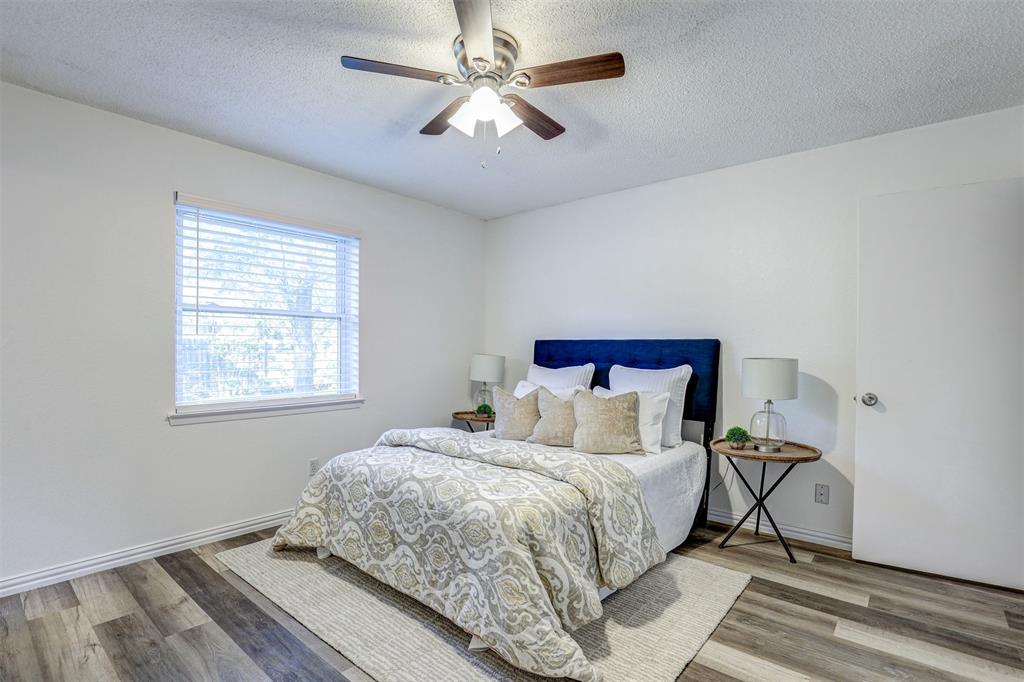 6005 Oak Hill Road Watauga, TX 76148 - Photo 13 of 22 a bedroom with a bed and a window
