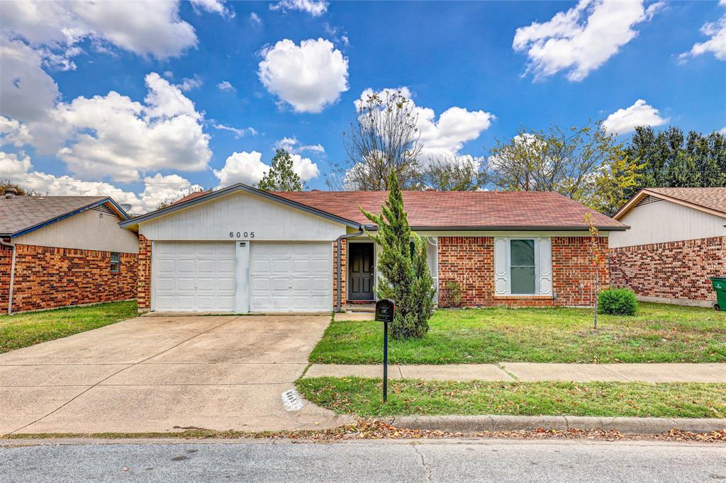 6005 Oak Hill Road Watauga, TX 76148 - Photo 2 of 22 a front view of a house with garden