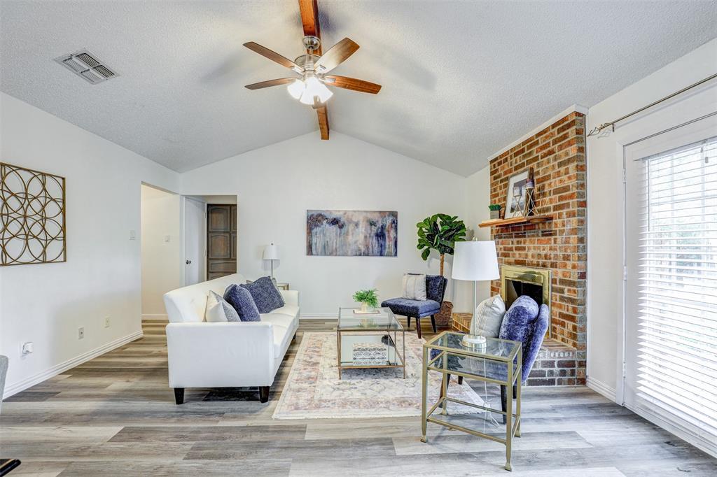 6005 Oak Hill Road Watauga, TX 76148 - Photo 7 of 22 a living room with furniture and a fireplace