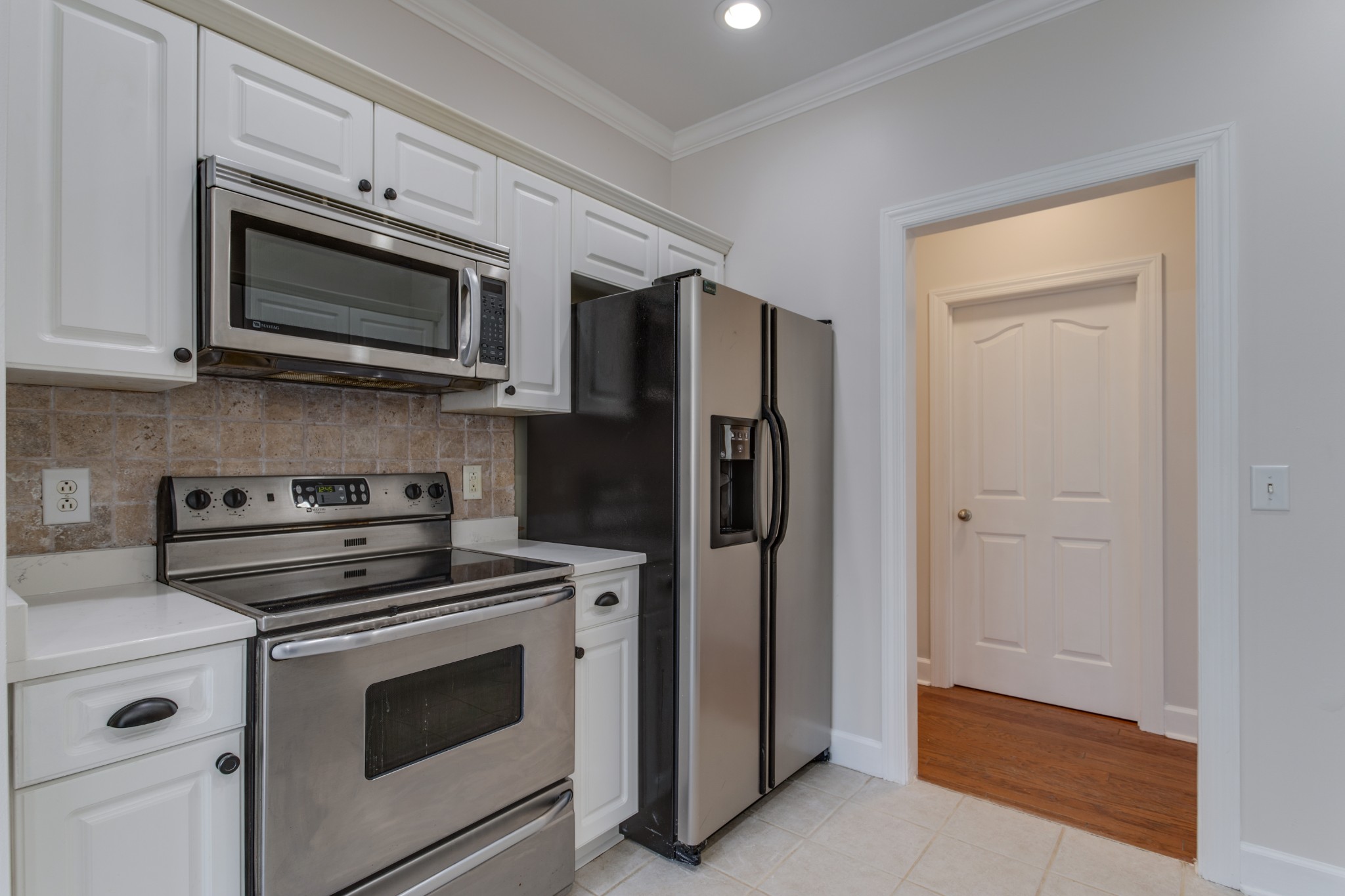 433 Bethany Circle Murfreesboro, TN 37128 - Photo 4 of 23 a kitchen with stainless steel appliances white cabinets and stove