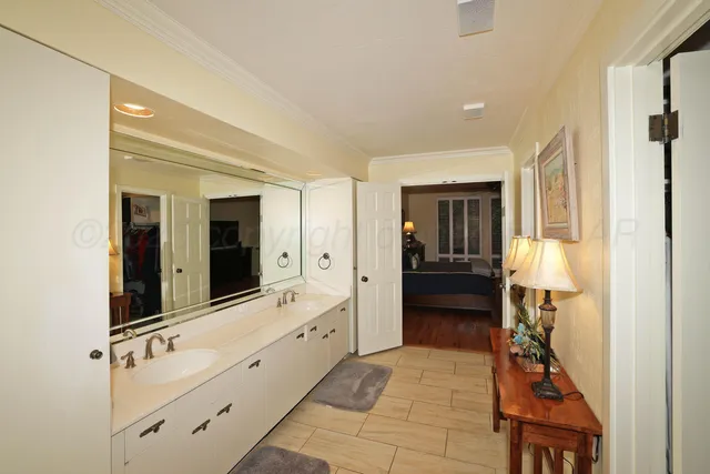 a bathroom with a sink and a large mirror