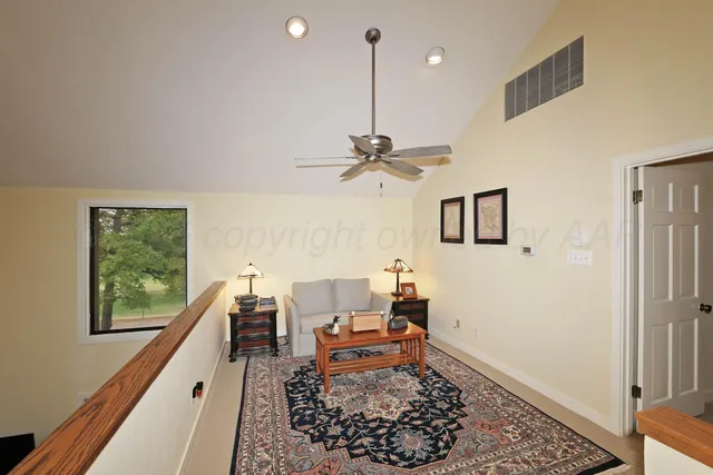 a living room with a couch and a rug