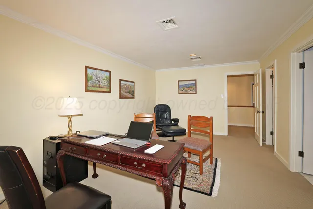 a view of a workspace with furniture