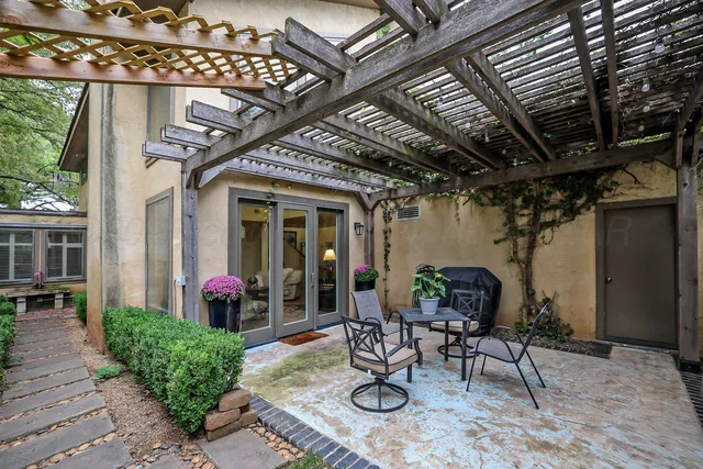 a view of a chairs and table in a patio