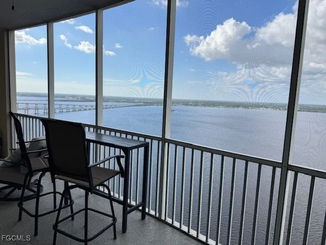 a view of a balcony with furniture
