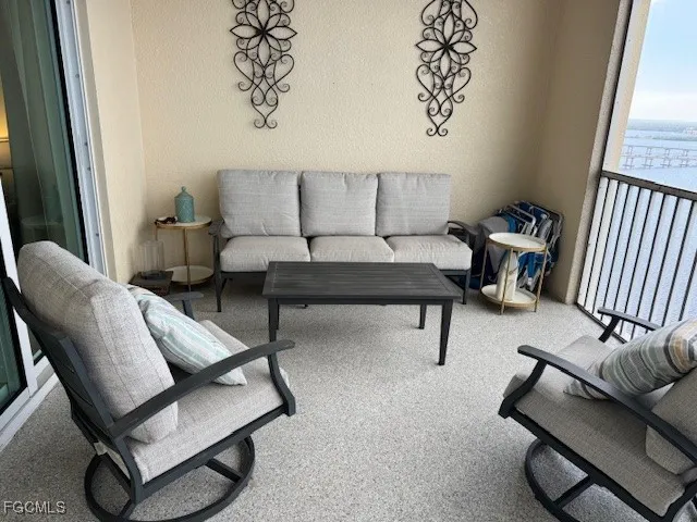 a living room with furniture and a window