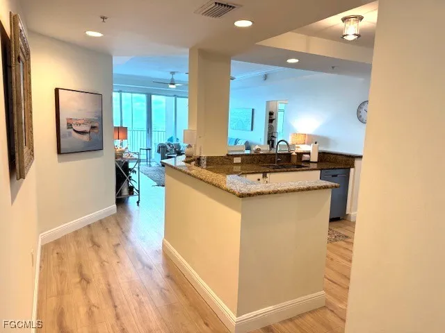 a kitchen with a sink and cabinets
