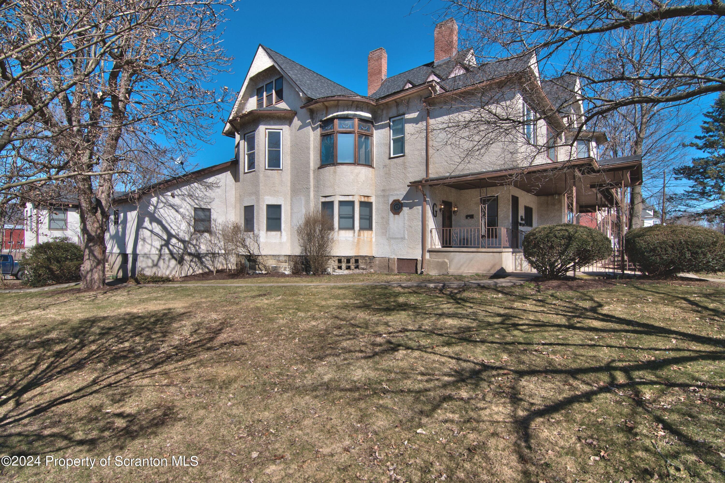 1543 Sanderson Avenue, Unit 1B Scranton, PA 18509 - Photo 12 of 12 a front view of a house with garden