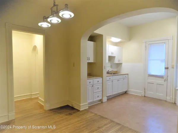 a utility room with cabinets washer and dryer