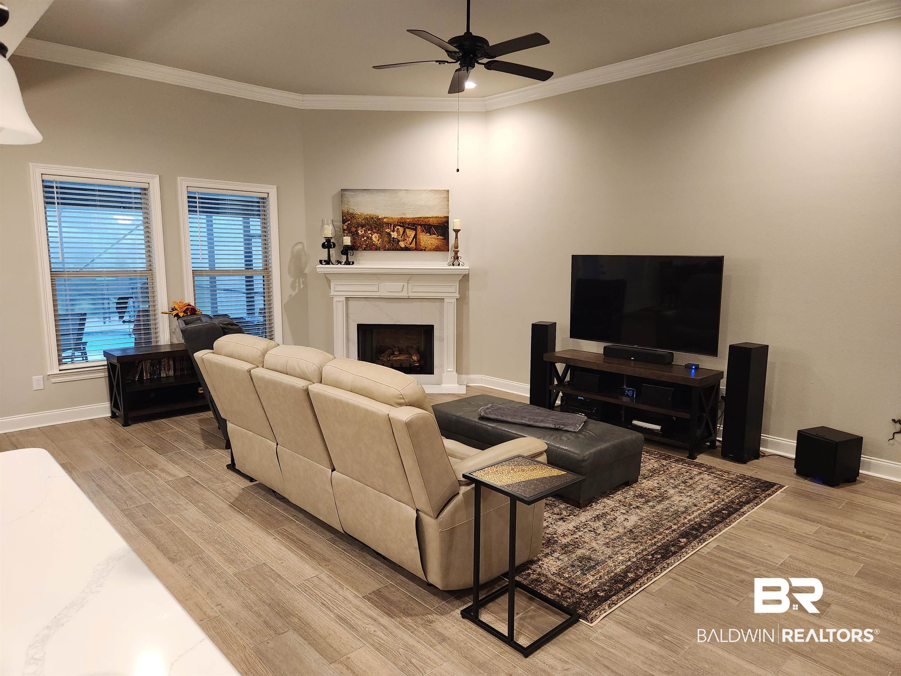 22280 Hibiscus Circle Foley, AL 36535 - Photo 7 of 8 Living room with ornamental molding, a fireplace, light wood-style flooring, and ceiling fan