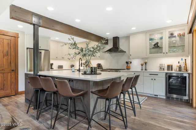 a kitchen with a table and chairs in it