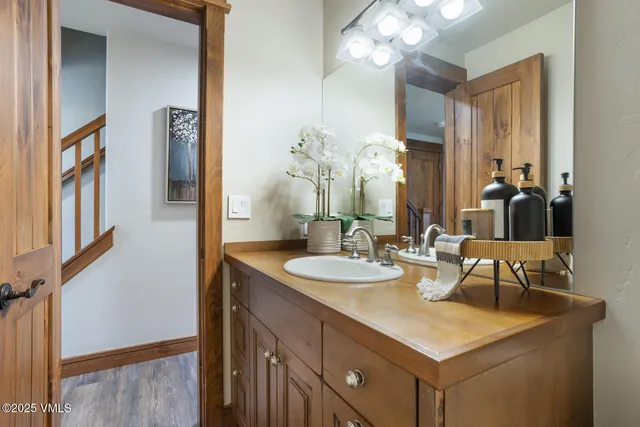 a bathroom with a sink vanity and a mirror