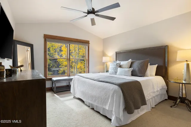 a bed room with a bed and a desk