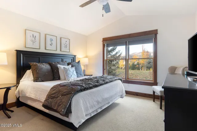 a bedroom with a bed and a desk