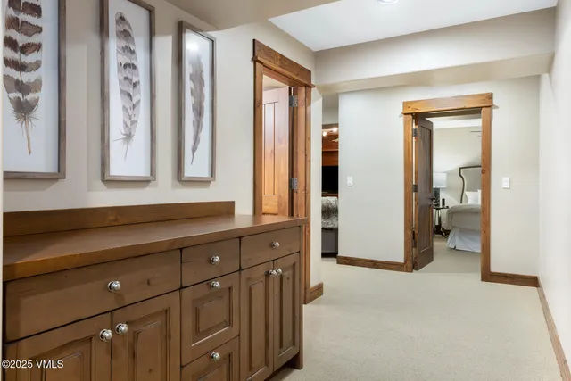 a bathroom with double vanity sink and a mirror
