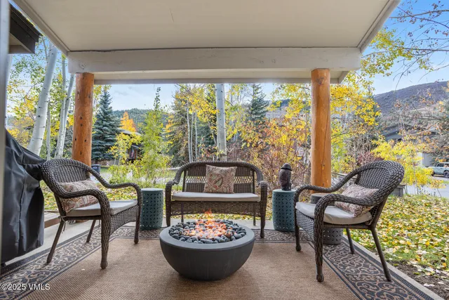 a view of a dining room with a table and chairs